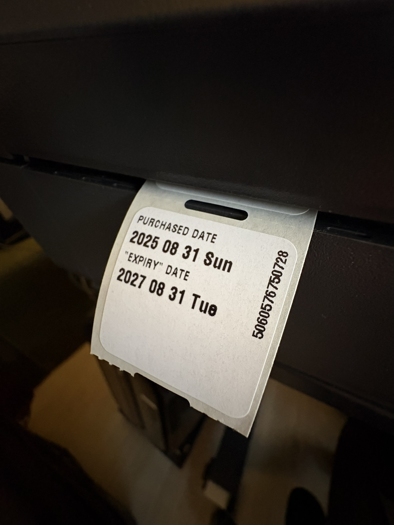 A small label coming out from a label printer. It says Purchase Date 2025 08 31 Sun, and "Expiry Date" 2027 08 31 Tue. 